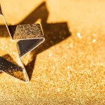 Star on gold bokeh background sparkling christmas ornament